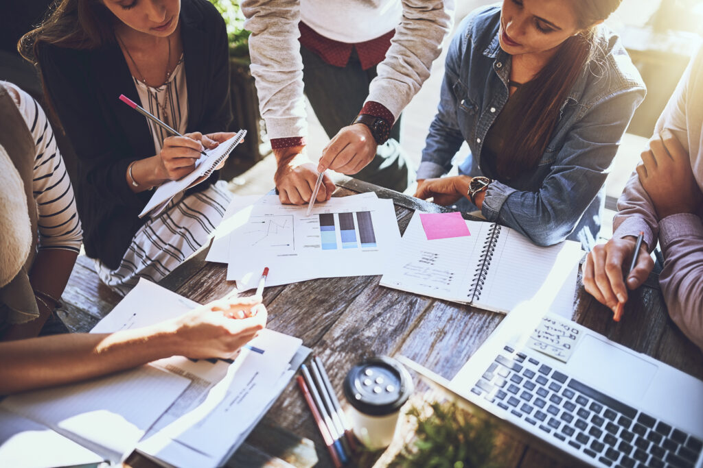 Business hands, team and meeting with data analysis, statistics and planning for online SEO solution. Group analyst or people with documents, graphs or charts and computer for startup collaboration